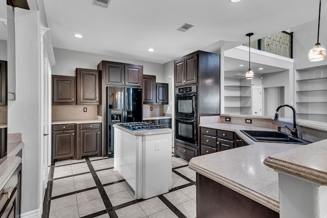 kitchen with kitchen peninsula, dark brown cabinetry, sink, black appliances, and hanging light fixtures