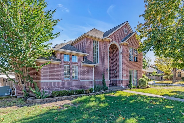 view of property featuring a front lawn