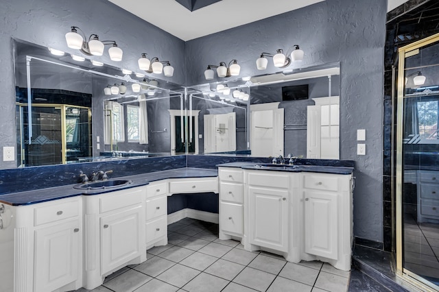 bathroom featuring tile patterned floors, vanity, and an enclosed shower