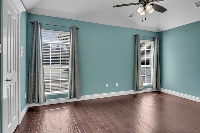 unfurnished room with a wealth of natural light, dark hardwood / wood-style floors, ceiling fan, and lofted ceiling