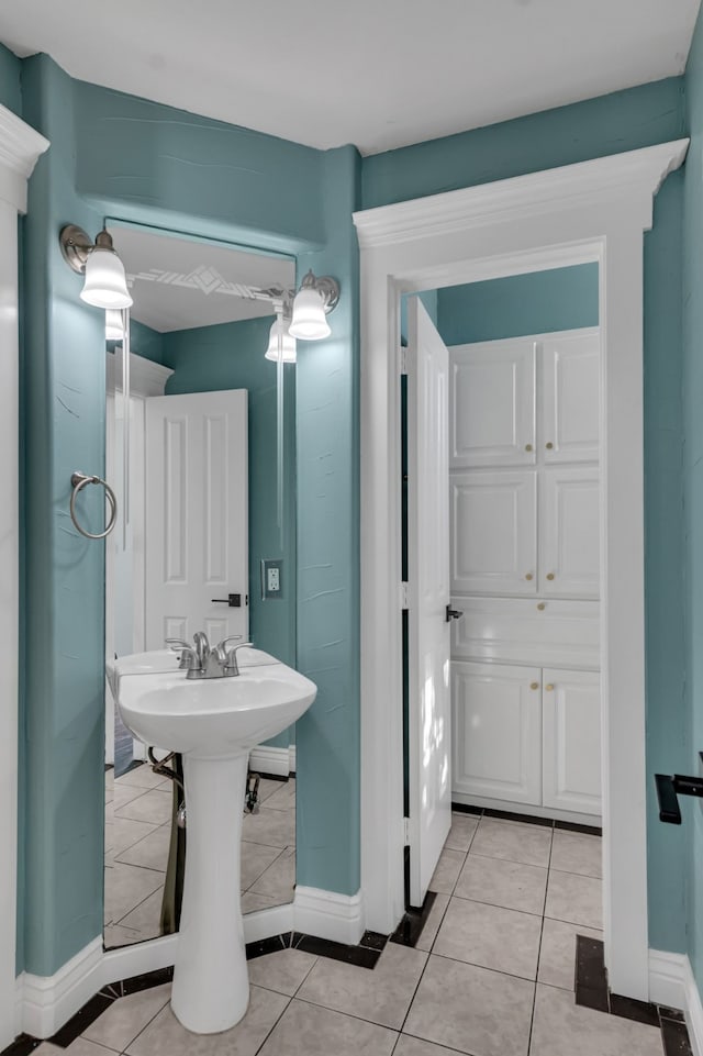 bathroom with tile patterned floors