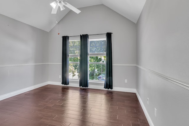 empty room featuring ceiling fan, dark hardwood / wood-style flooring, and vaulted ceiling