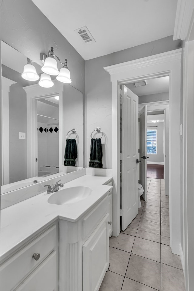 bathroom with vanity and tile patterned floors