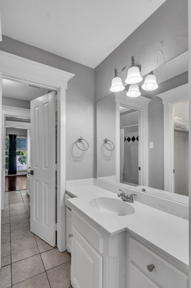 bathroom featuring tile patterned floors, vanity, and a shower with shower curtain