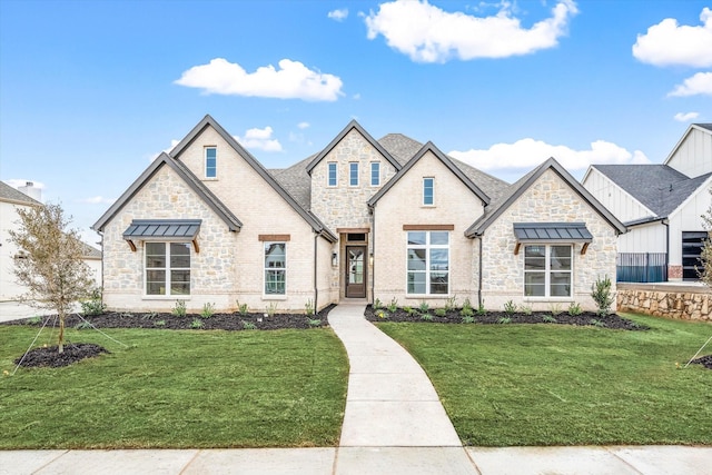 french country home with a front lawn