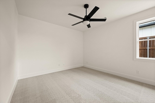 empty room with carpet flooring and ceiling fan