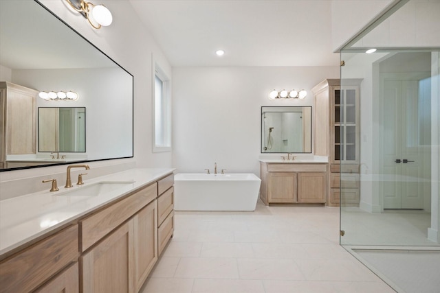 bathroom featuring plus walk in shower and vanity