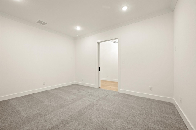 empty room with carpet floors and ornamental molding