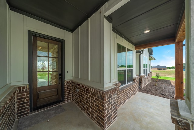 doorway to property featuring covered porch