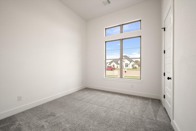 unfurnished room featuring carpet