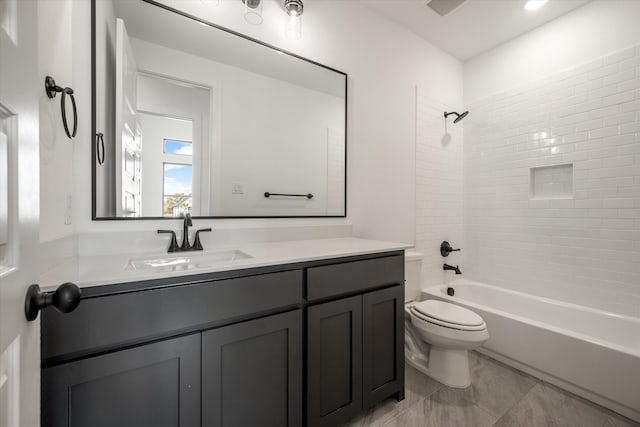 full bathroom with tiled shower / bath combo, vanity, and toilet