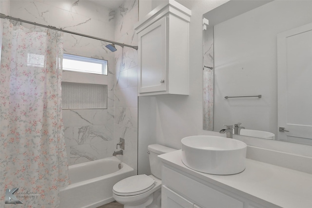 full bathroom with vanity, toilet, and shower / bath combo with shower curtain