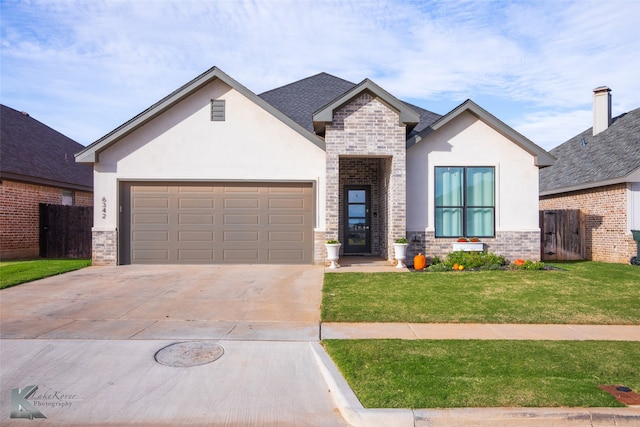 view of front of house featuring a garage and a front yard