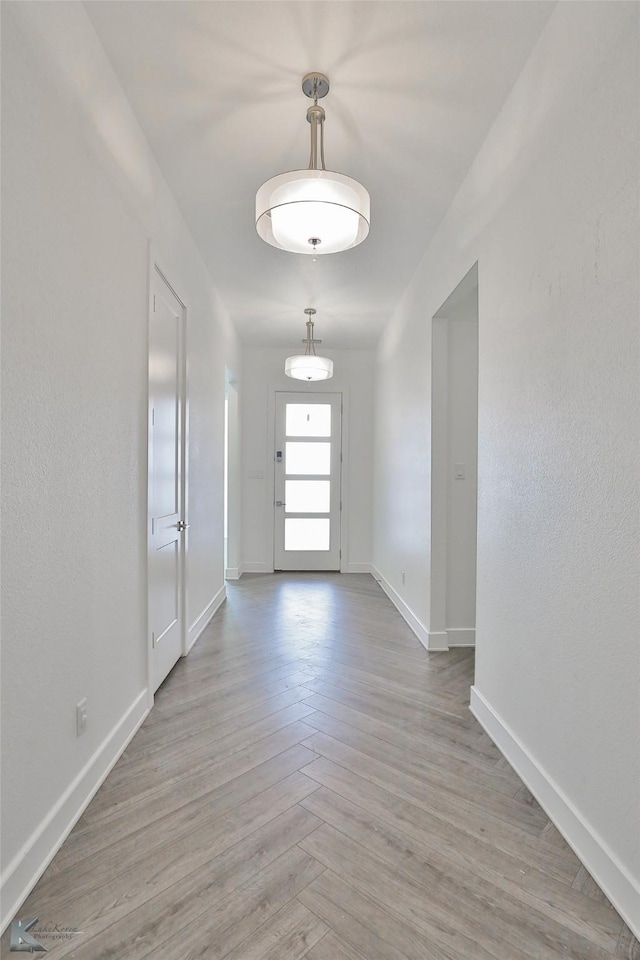 entryway with light parquet flooring