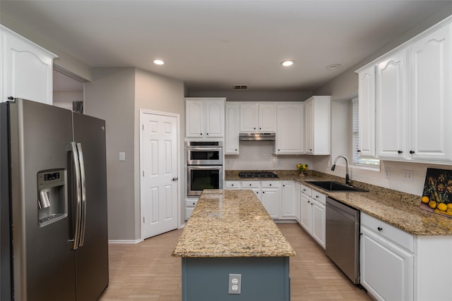 kitchen with stone countertops, sink, white cabinetry, and appliances with stainless steel finishes