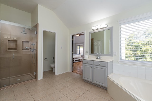 full bathroom featuring ceiling fan, tile patterned flooring, vanity, and lofted ceiling