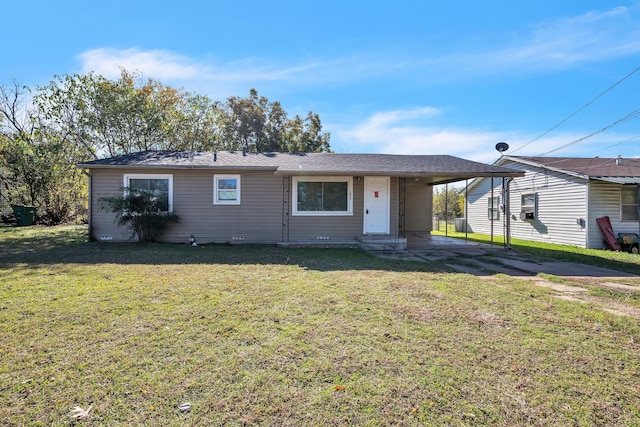 ranch-style home with a carport and a front yard