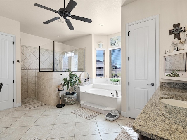 bathroom with shower with separate bathtub, vanity, tile patterned floors, and ceiling fan