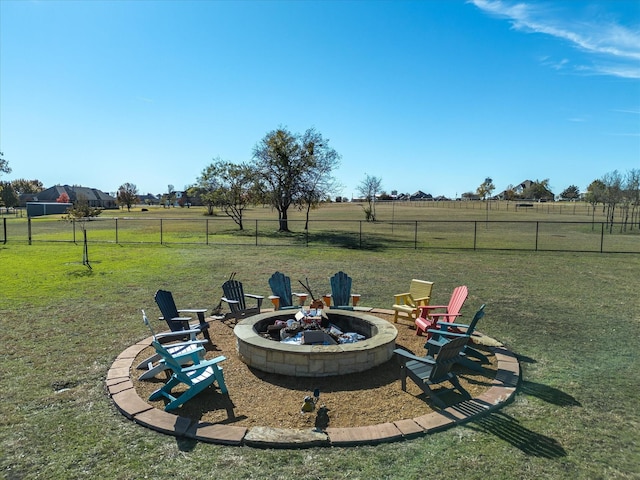 view of yard with a rural view and a fire pit