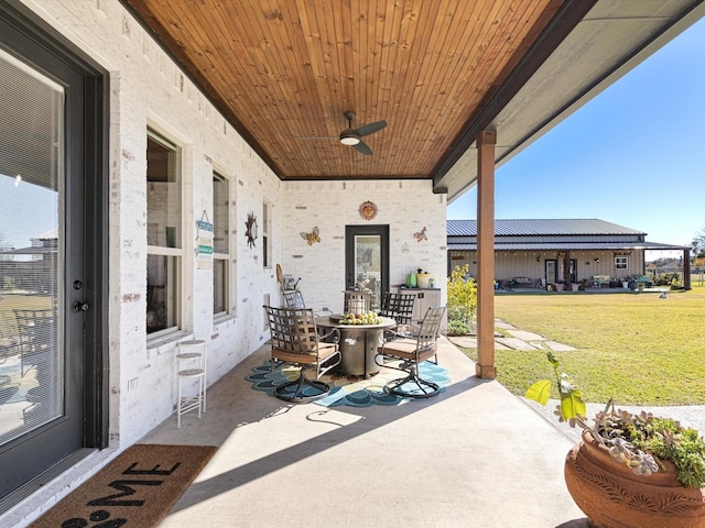 view of patio / terrace featuring ceiling fan