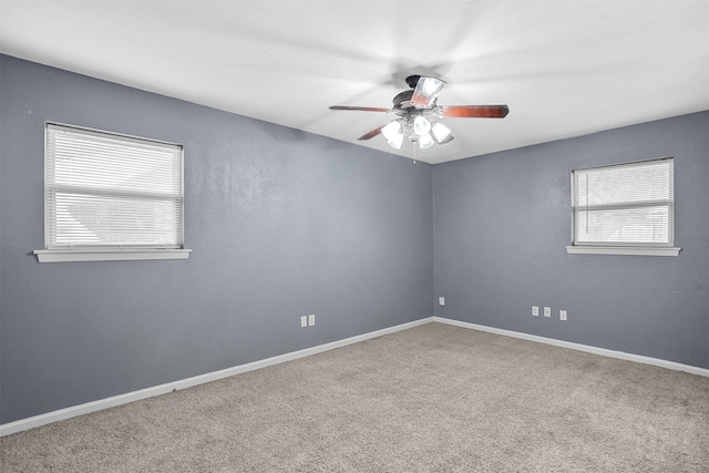 unfurnished room featuring carpet and ceiling fan