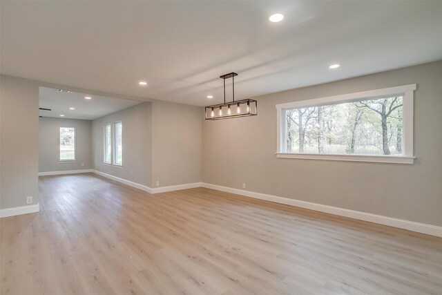 spare room with light hardwood / wood-style flooring