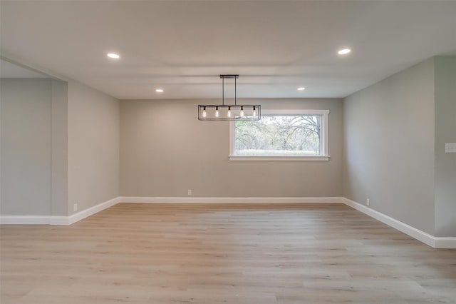 unfurnished dining area with light hardwood / wood-style floors