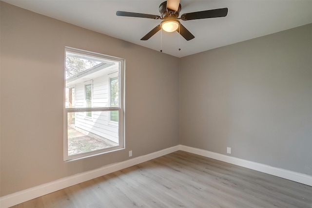 unfurnished room with light hardwood / wood-style flooring, plenty of natural light, and ceiling fan