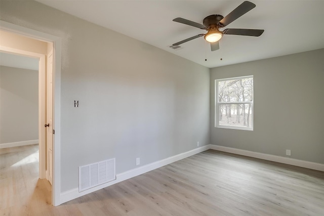 spare room with ceiling fan and light hardwood / wood-style flooring