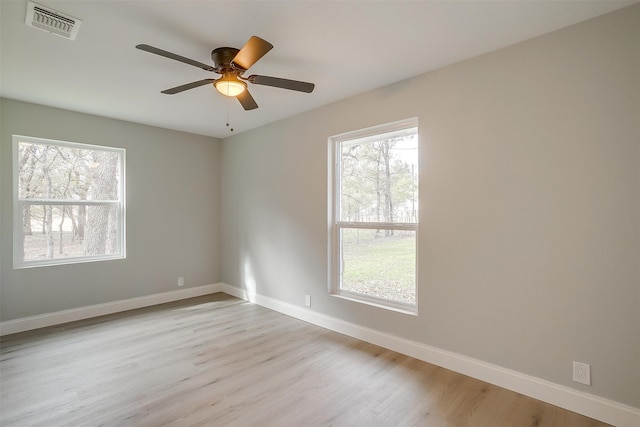 spare room featuring ceiling fan and light hardwood / wood-style flooring