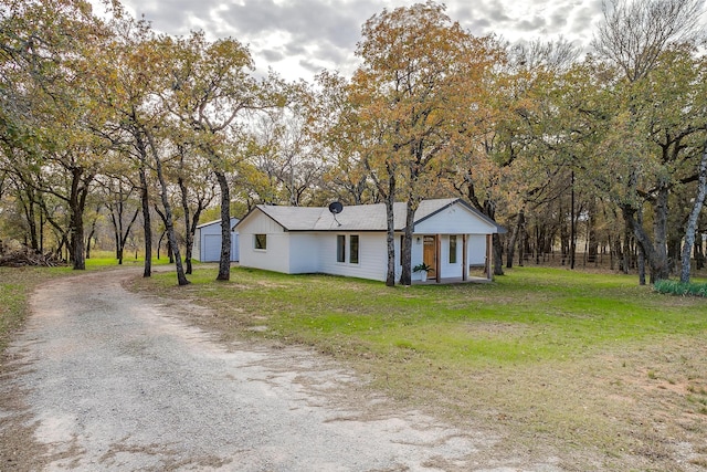 ranch-style home with a front lawn