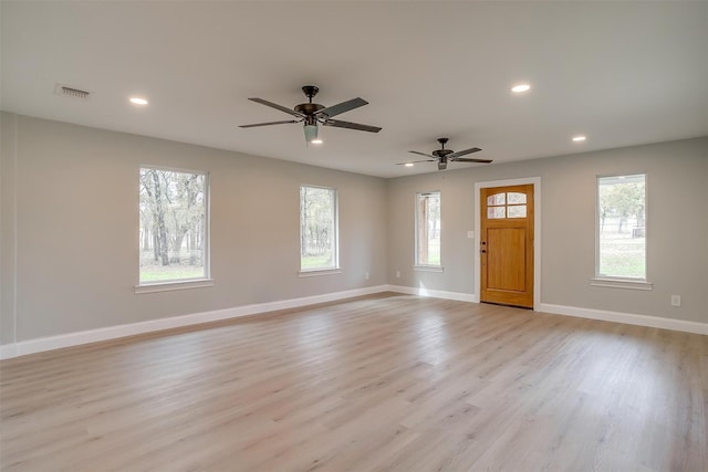 interior space featuring ceiling fan and light hardwood / wood-style floors