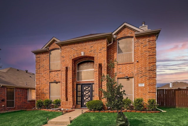 front facade with a yard