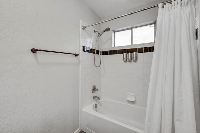 bathroom with shower / tub combo with curtain