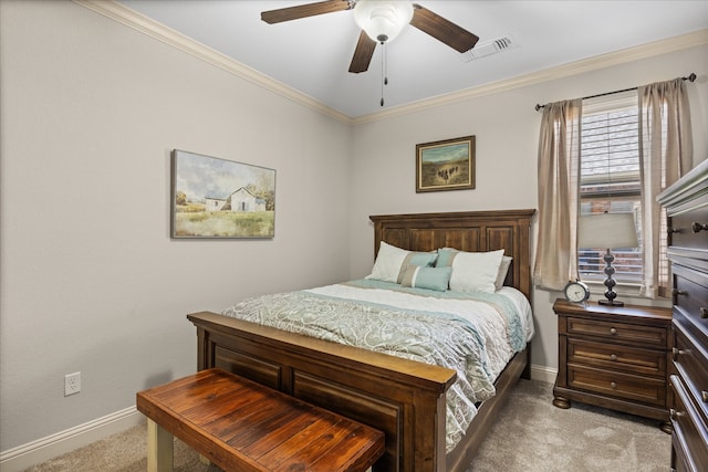 carpeted bedroom with ceiling fan and ornamental molding