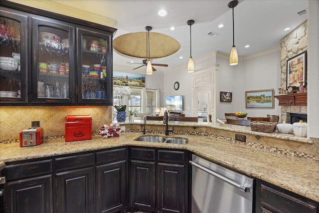 kitchen with crown molding, light stone countertops, tasteful backsplash, a kitchen bar, and stainless steel appliances