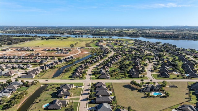 birds eye view of property featuring a residential view and a water view