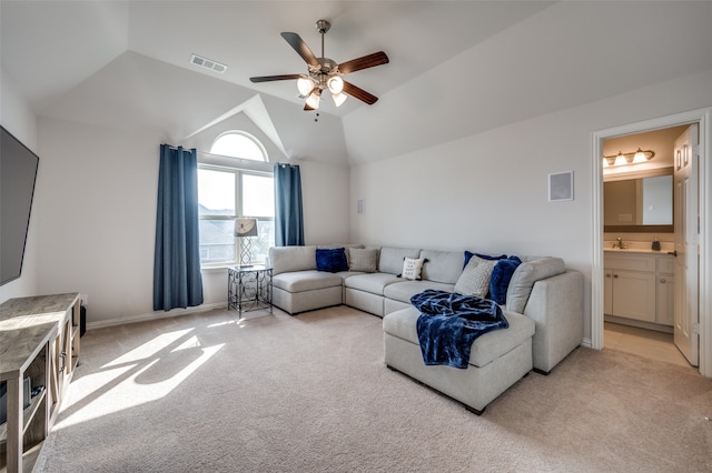 carpeted living room featuring ceiling fan, sink, and vaulted ceiling