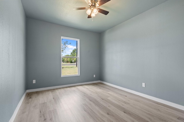 unfurnished room with ceiling fan and light hardwood / wood-style flooring