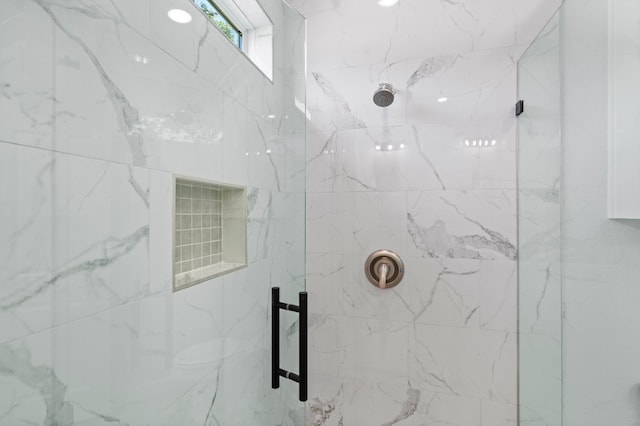 bathroom with tiled shower