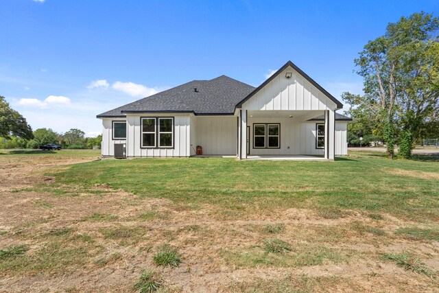 rear view of property with central AC, a yard, and a patio