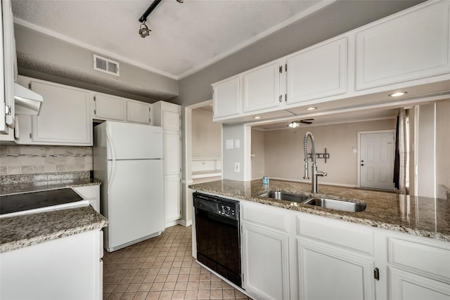 kitchen featuring rail lighting, sink, black dishwasher, white fridge, and white cabinetry