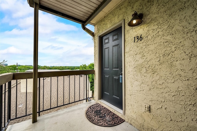 property entrance with a balcony