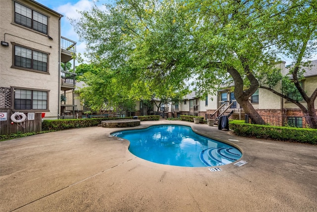 view of pool featuring a patio