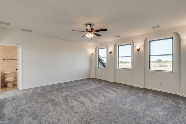 empty room with carpet floors and ceiling fan