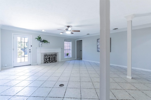 unfurnished living room featuring crown molding, light tile patterned flooring, and ceiling fan