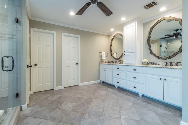 bathroom with ornamental molding, a shower with shower door, and vanity