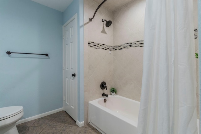 bathroom featuring shower / tub combo, tile patterned floors, and toilet