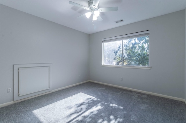 empty room with carpet floors and ceiling fan