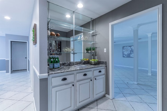 bar with light tile patterned flooring